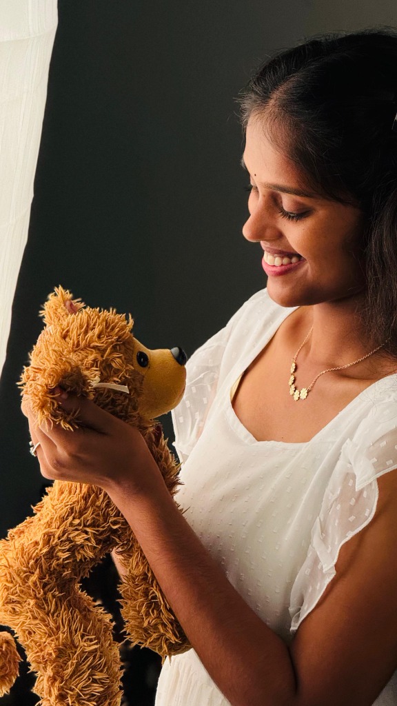 Woman holding a teddy bear